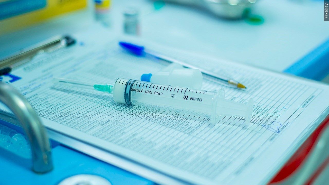 Medical chart sheet with syringe.