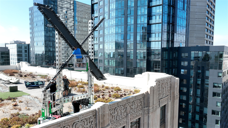Workers start to dismantle a large X logo on the roof of X headquarters on July 31, 2023 in San Francisco, California.