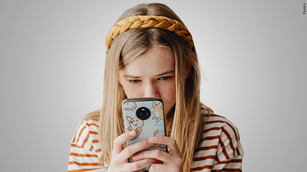 Girl looking at smartphone