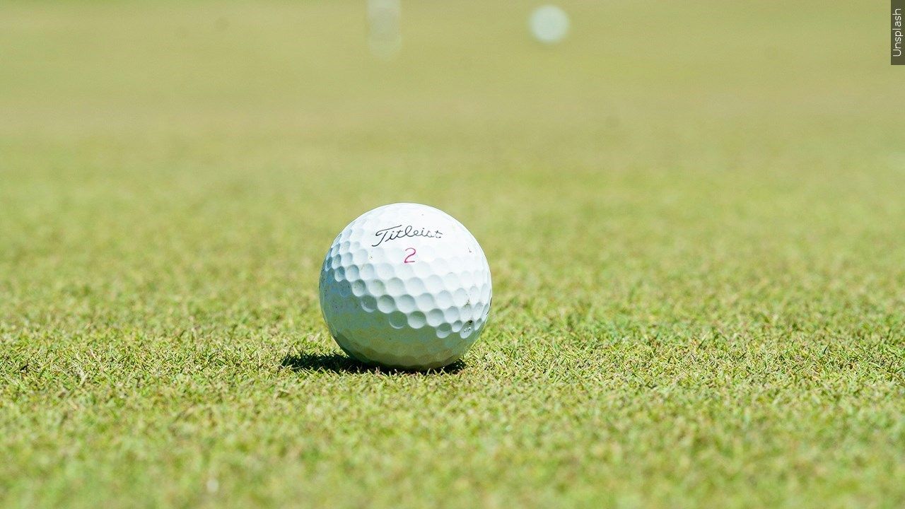 Golf ball on green grass