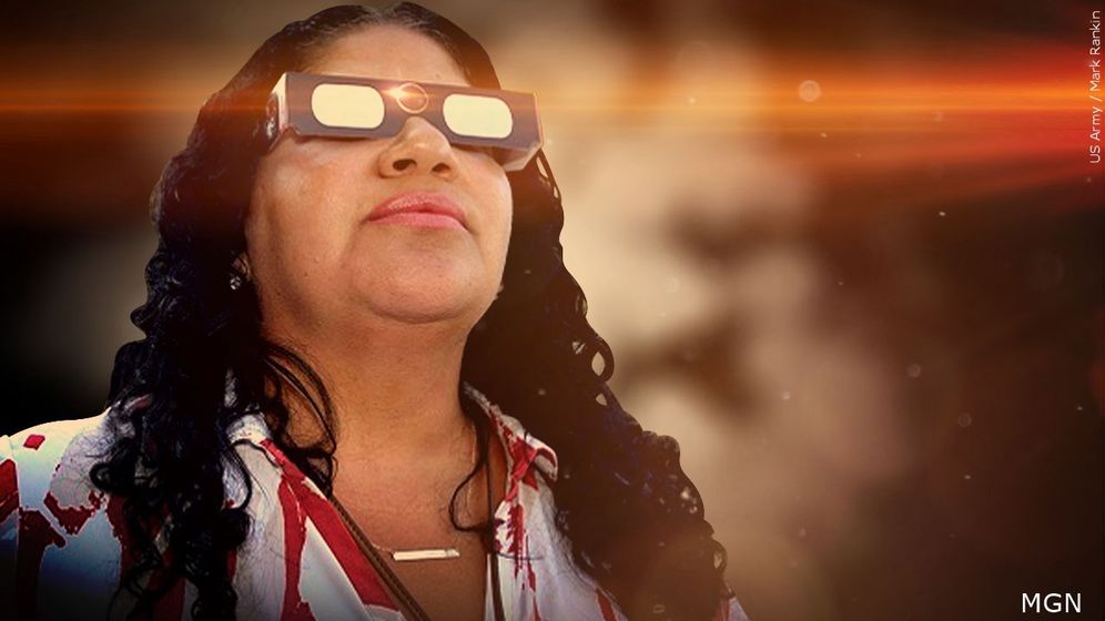 Woman wearing solar eclipse glasses