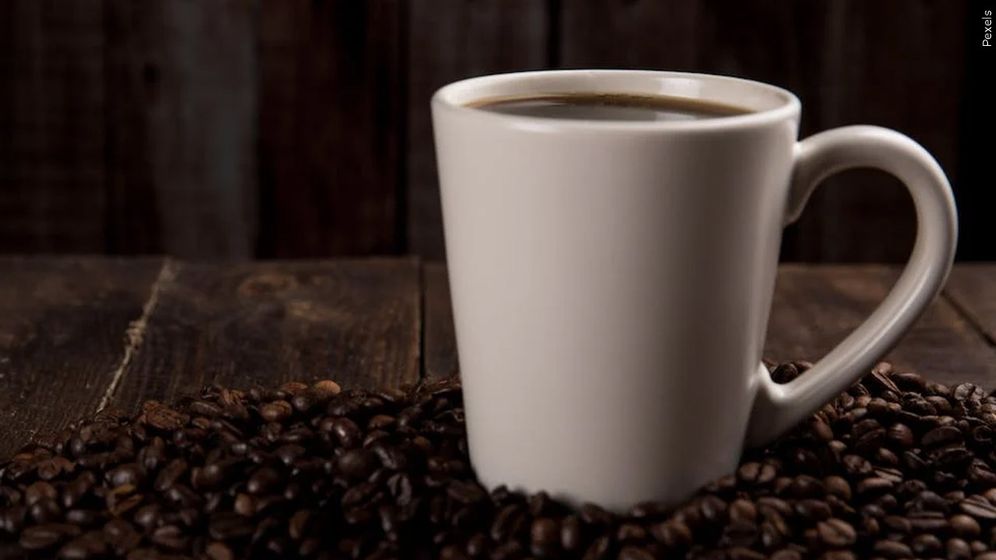 Coffee cup and beans.