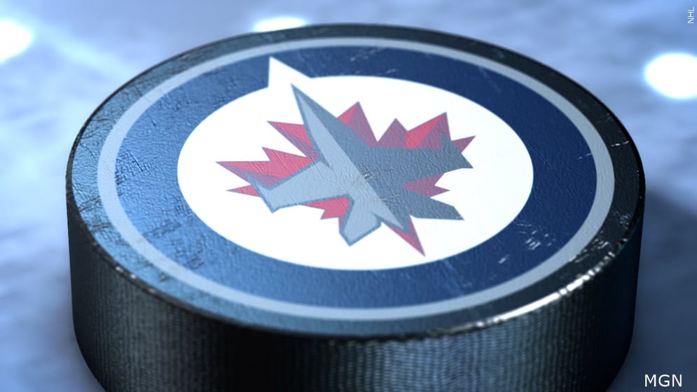 Winnipeg Jets logo on hockey puck.