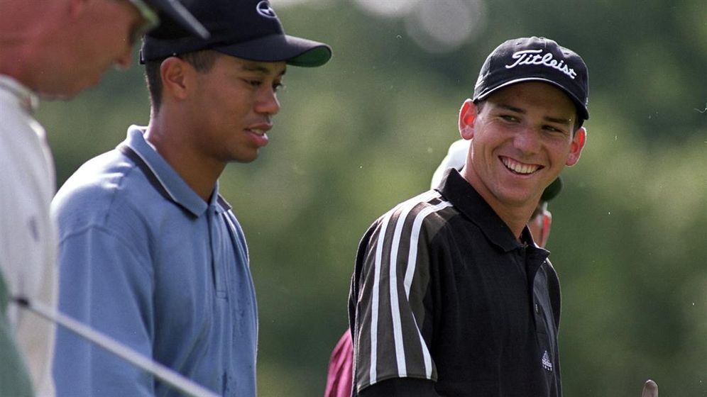 Sergio Garcia smiles at Tiger Woods as they walk together during the PGA Championships at the Medinah Country Club in Medinah, Illinois.