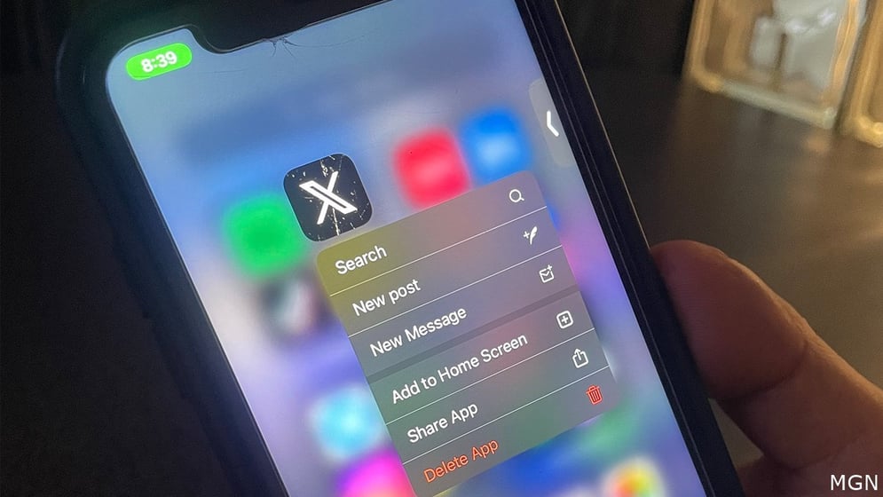 Social media platform X app on a phone